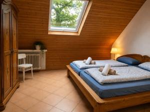 a bedroom with two beds and a window at Odw homes - 3Room Apartment for Workers in Weinheim