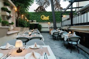 a restaurant with tables and chairs on a patio at imera hotel in Edirne