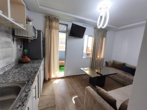 a kitchen and living room of a apartment at Younes résidence 2 in Asilah