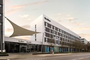 a large white building with a large building at The Rilano Hotel Munich, Trademark Collection by Wyndham in Munich