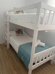 a couple of bunk beds in a room at Casa Boho in Puerto de Mazarrón