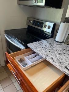 a kitchen with a stove and a counter top at Dolphin Cove in Sarasota