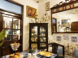 a dining room with a glass table and a mirror at On the House homestay in New Delhi