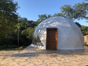a large dome tent with a door in it at Private Dome Relax in Nature in San Bernardino