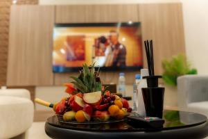 a tray of fruit on a table in a room at منتجع ليورا ــ Liora Resort in Al Ḩanī +62 photos