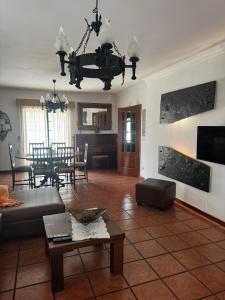 a living room with a couch and a table at Casa do Alto in Recarei