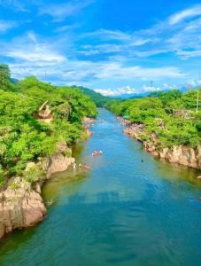 a group of people swimming in a river at Hotel Montserrat Luxury in Valledupar