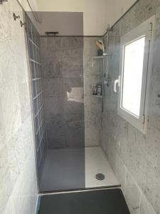 a shower with a glass door in a bathroom at Baia Serena in Sestri Levante +24 photos