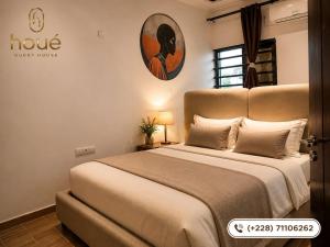 a bedroom with a large bed in a room at Résidence Houé 