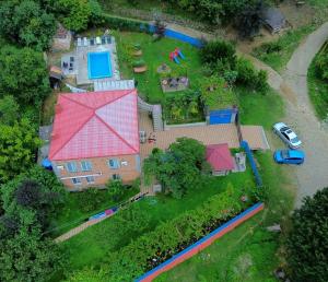 an aerial view of a large house with a yard at Iveri House in Kutaisi