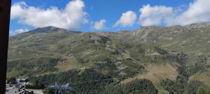 a view of a mountain with trees on it at les Lauzes in Les Menuires