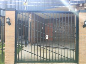 a metal gate with the number on it at Hotéis Online in Boa Vista