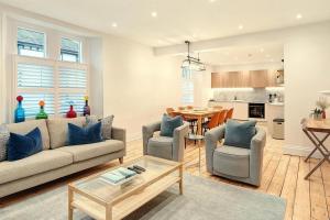 a living room with a couch and chairs and a table at 4 Bed in Windermere oc-lr026 in Windermere