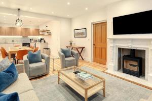 a living room with a couch and a fireplace at 4 Bed in Windermere oc-lr026 in Windermere