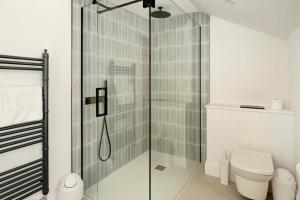 a bathroom with a glass shower with a toilet at 4 Bed in Windermere oc-lr026 in Windermere +33 photos