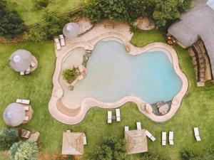 an overhead view of a swimming pool in a yard at Montusi Self-Catering Cottages in Bergville