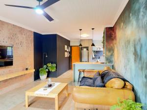 a living room with a couch and a table at Fine Stay Clarens in Clarens