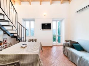 a living room with a couch and a table at Borgo Pasqui in Diano Marina