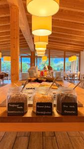a kitchen with jars of food on a counter at Seehotel am Hallstättersee modern rooms with AC in Obertraun