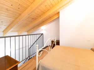 a bedroom with a bed and wooden ceilings at Borgo Pasqui in Diano Marina +115 photos