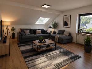 a living room with a couch and a coffee table at Im Weidig in Obernburg am Main