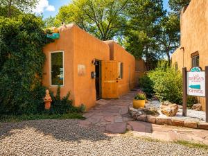 a building with a sign in front of it at Las Brisas de Santa fe in Santa Fe