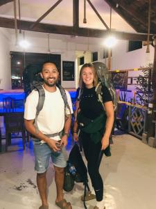 a man and a woman posing for a picture at Yellow bay inn in Arugam Bay