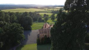 an aerial view of an old house in a field at Murrayshall Country Estate in Perth +159 photos