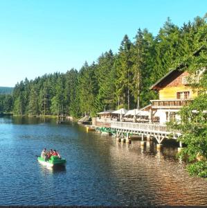 a group of people in a boat on a lake at Haus Schneebergblick in Röslau