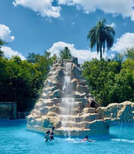 a waterfall in the water at a water park at Casa de huéspedes cochera cubierta in Oberá