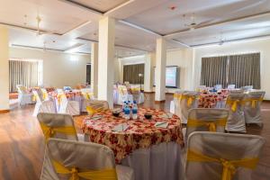 a banquet hall with tables and chairs in a room at Manas Resort Udaipur in Udaipur +84 photos