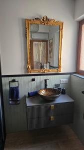 a bathroom with a sink and a mirror at L'Orée du Loup in La Colle-sur-Loup