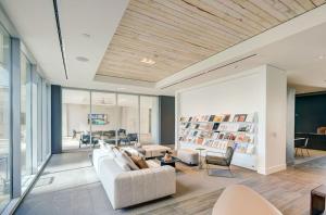 a living room with a couch and a table at CozySuites at Adeline in Phoenix