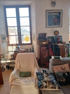 a living room with a couch and a chair at A casetta in Bastia