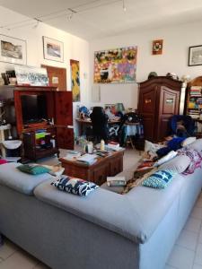 a living room with two large couches and a table at A casetta in Bastia