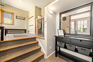 a staircase in a home with a window at Tremblant Prestige - Clairiere 406 in Mont-Tremblant