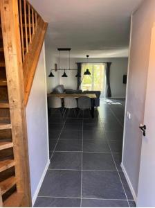 a hallway with a table and a dining room at Marieborg Apartments in Ekshärad