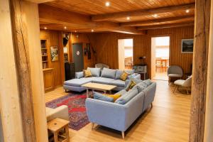 a living room with two couches and a table at Chalet Rosablanche, since 1929 - peace, quiet & tradition in Nendaz