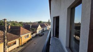 a view of a street from a window of a building at Complex Casa Morii in Orăştie