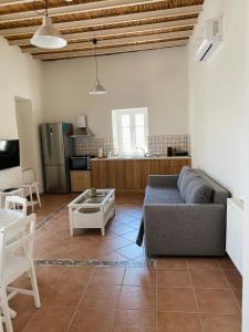 a living room with a couch and a table at Matsipeti in Kythira