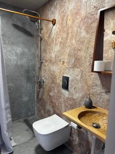 a bathroom with a toilet and a sink at Meteoron Platanias in Platanias