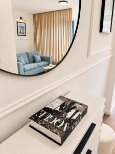 a living room with a mirror on the wall at Fontana Lux Apartment in Belgrade