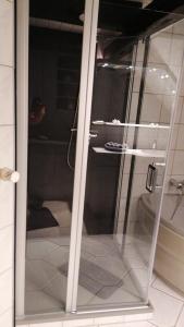 a glass door to a bathroom with a toilet at WendlandHuus in Woltersdorf +9 photos