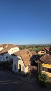 a group of buildings with roofs and a train at Complex Casa Morii in Orăştie +2 photos