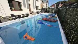 a swimming pool with toys in the water at AmurResidence 64 Sauna Parking Barbeque in Iaşi