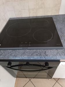 a stove top oven sitting on top of a counter at F5 à Montjaux in Montjaux