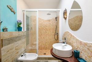 a bathroom with a sink and a shower at Casa Sherazad in Tías +21 photos