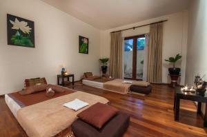Voodi või voodid majutusasutuse Lotus Blanc Resort toas