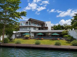 a house on the water with a dock at Aradhana by Nepali in Moratuwa
