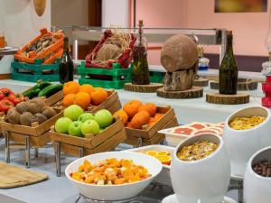 a buffet with bowls of fruits and vegetables on a table at Ibis Gaziantep in Gaziantep